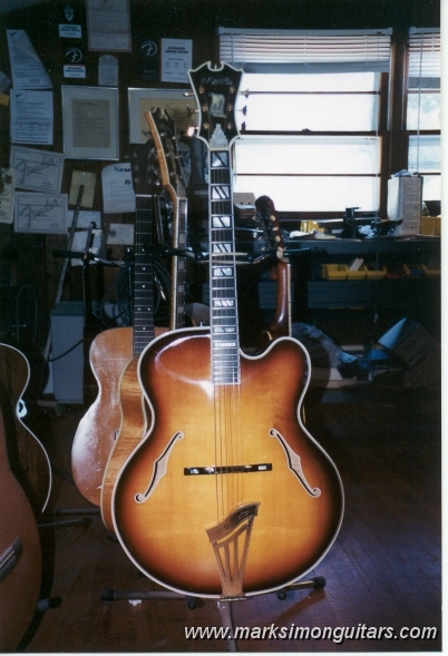 67d'aquistostandbig.jpg - Front shot on stand of D'Aquisto #1016, patiently waiting for a new pickguard