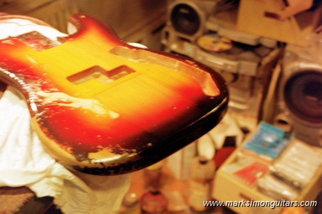 10_0011.jpg - Patch has been installed, finish sanded to level of existing surrounding lacquer, color matching has begun.
